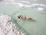 Girl Floating in Dead Sea